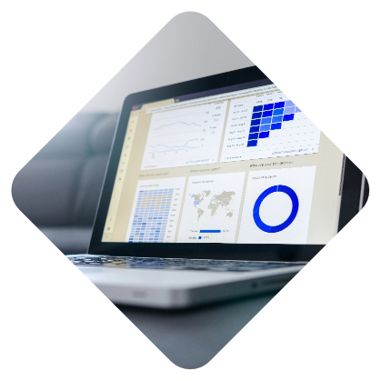 A laptop displaying various graphs and data analysis charts on its screen